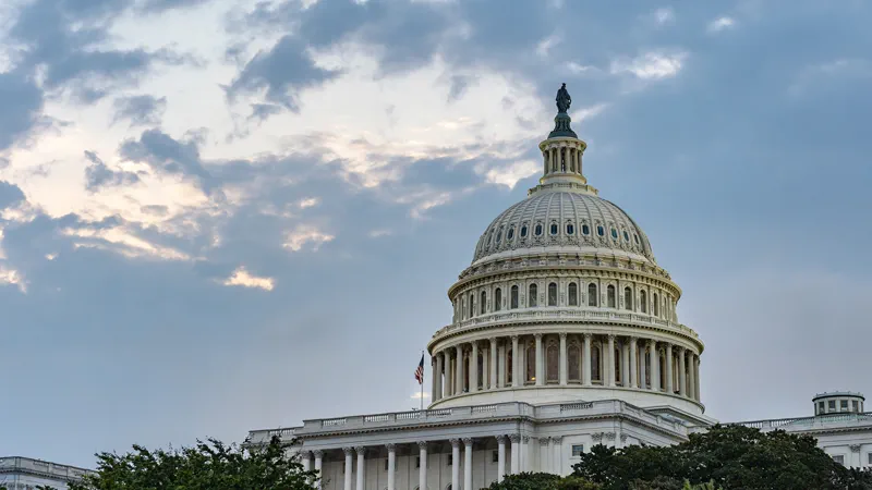 The US Capitol dome in Washington DC under a dramatic morning sky